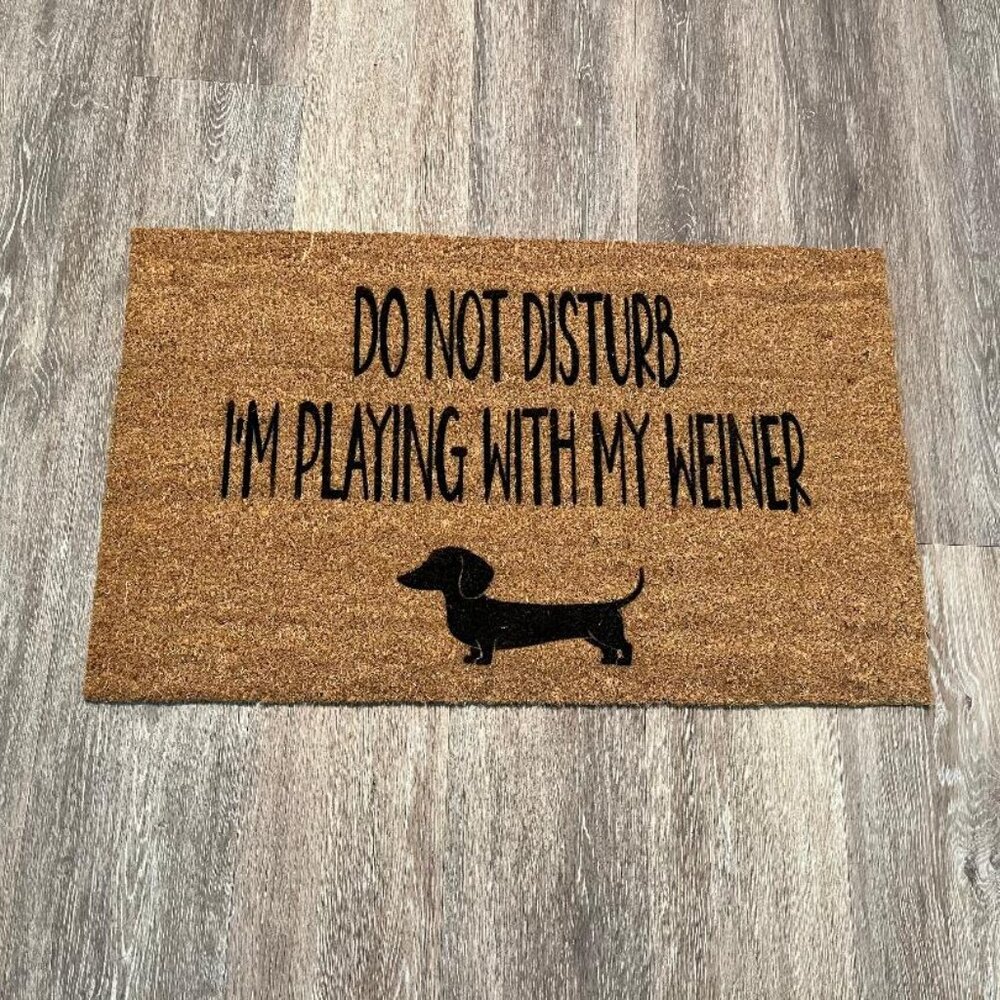 Playing with my Weiner decorative coir doormat